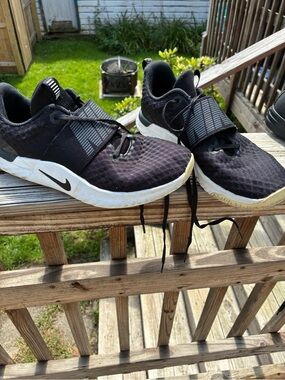 Nike women’s  Black and White Slip-On Strap Sneakers